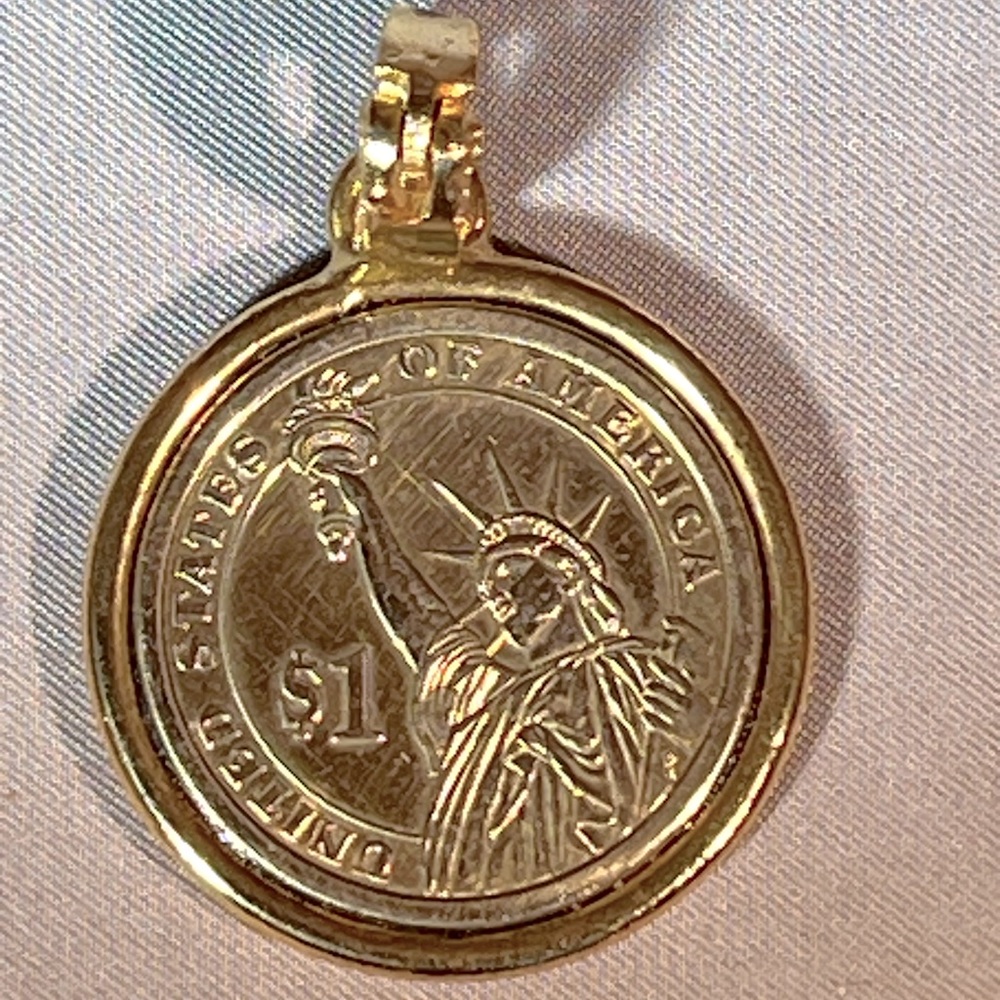 Authentic US $1.00 Coin Charm, Gold Tone Frame & Clasp. Suitable for a necklace.